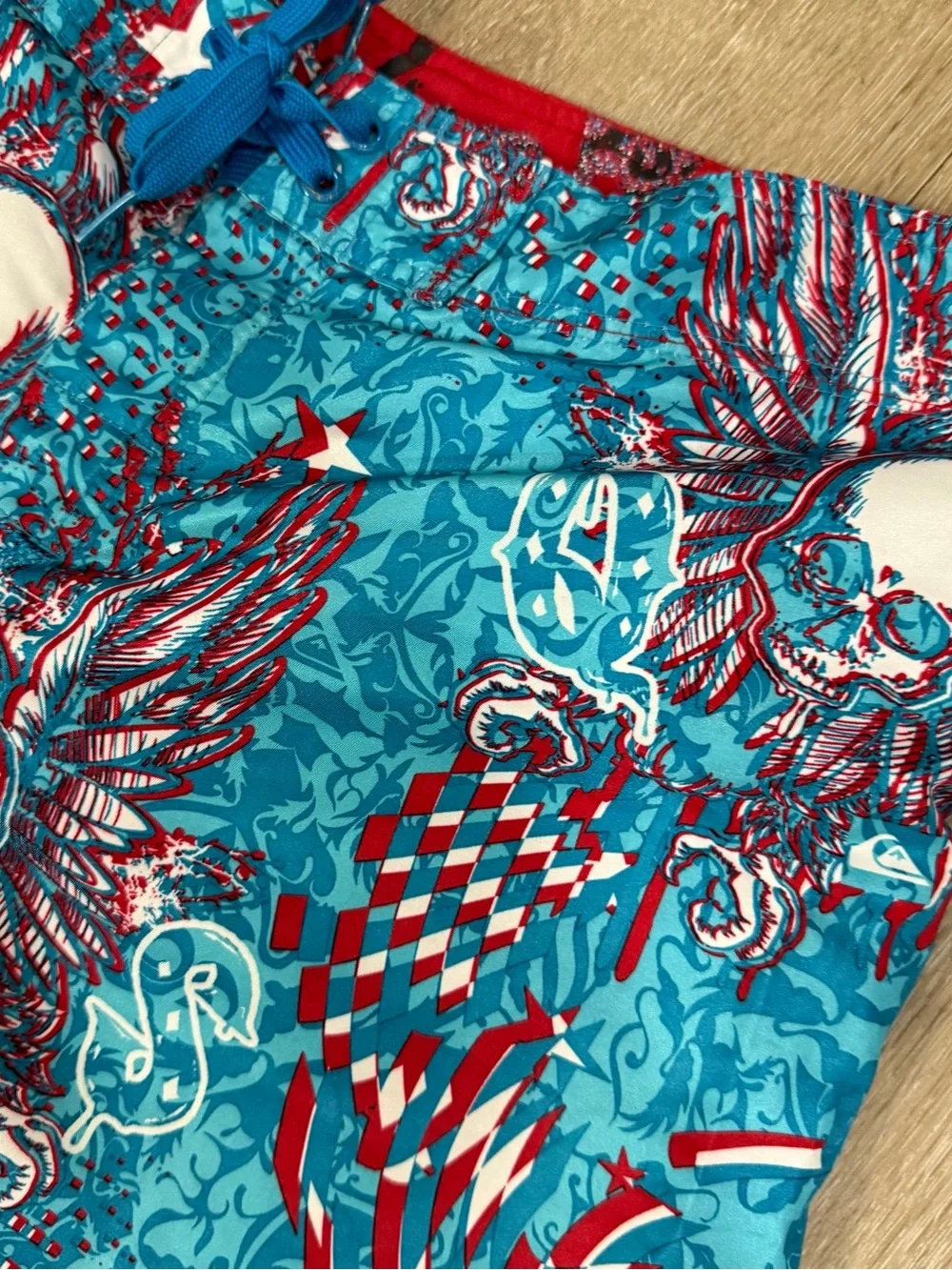 Quiksilver Turquoise & Red Winged Skull Print Swim Trunks